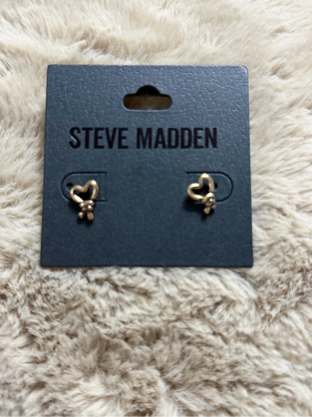 Steve Madden Gold Heart Knot Earrings on Display Card